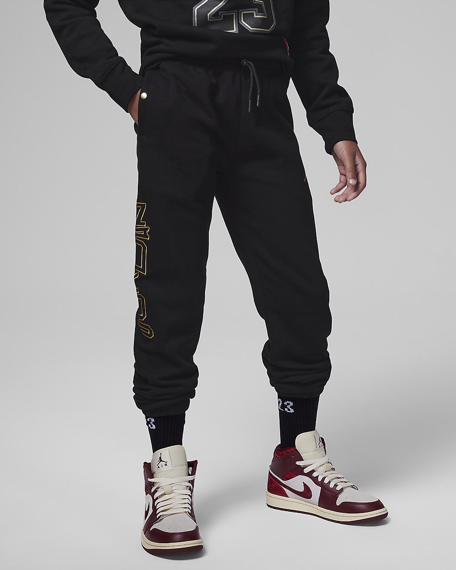Black and gold jordan joggers discount